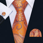 Men's orange tie with unique necktie designs featuring floral patterns, paired with a matching pocket square