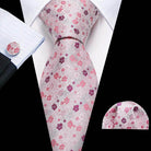 Elegant men's tie with unique necktie designs featuring pink floral patterns on a light background