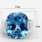 Unique silver cocktail ring featuring a large blue faceted gemstone, perfect for special occasions
