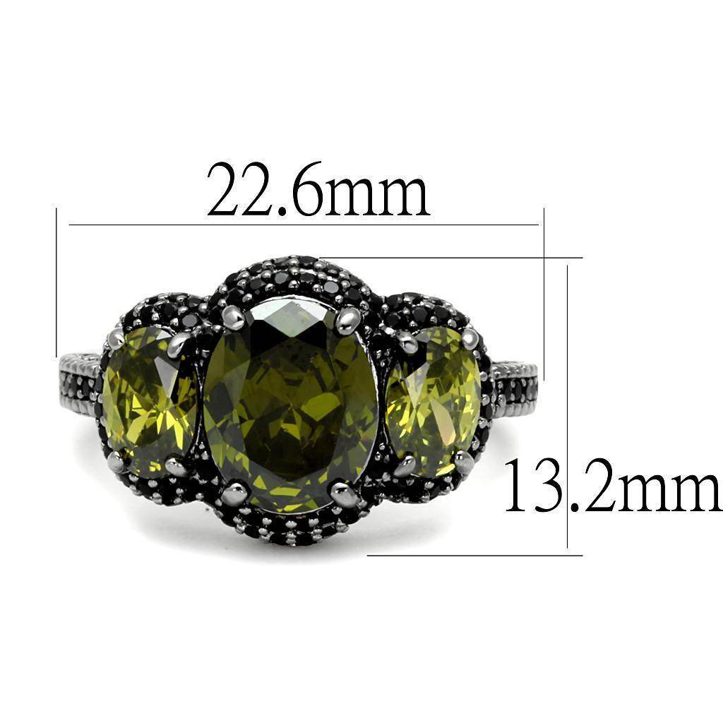 Unique vacation jewelry for women featuring a three-stone ring with oval green gemstones set in black metal
