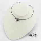Unique vacation jewelry for women featuring a choker necklace and matching stud earrings