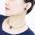 Unique vacation jewelry for women featuring a black floral necklace and matching earrings set