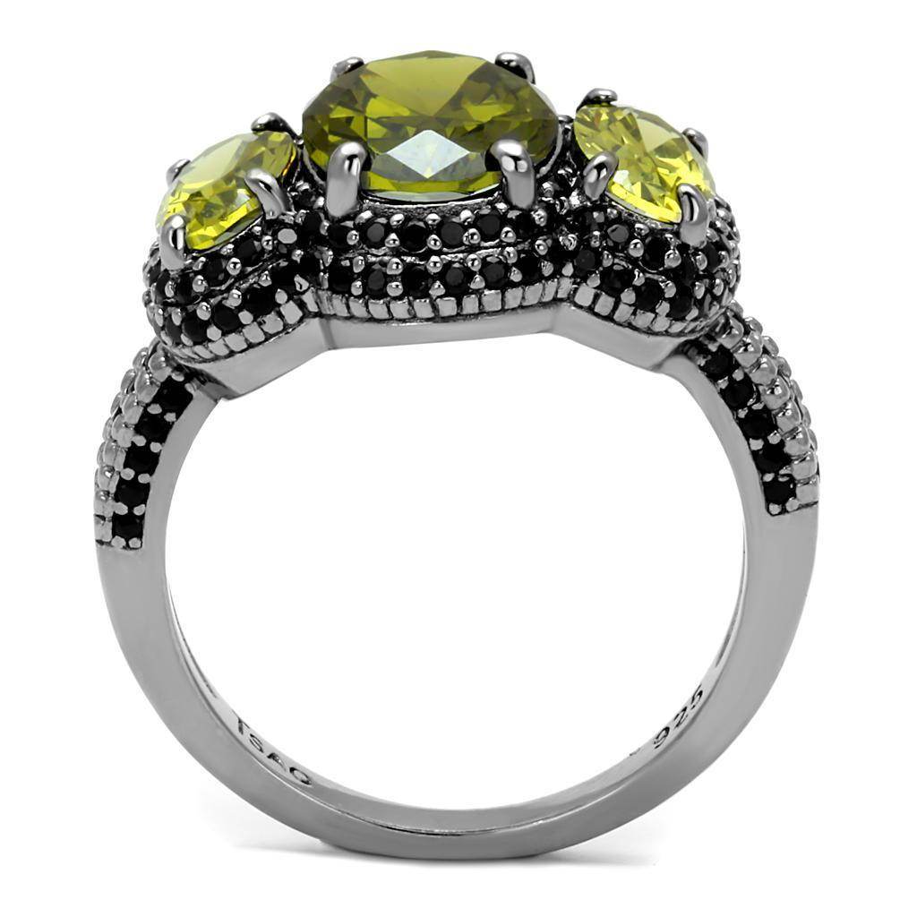 Unique vacation jewelry for women featuring a three-stone ring with green gemstones and intricate detailing