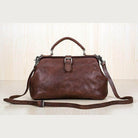 Brown leather unisex shoulder bag for travel with a stylish design and adjustable strap