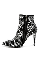 Stylish urban studded ankle boots for women with a sleek design and pointed toe in black and white