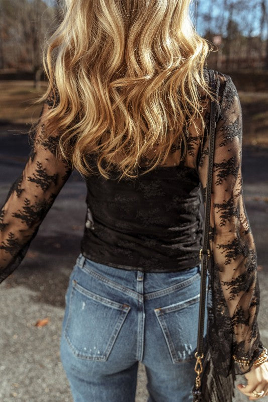 YNIQUE black lace mesh long sleeve blouse back view on woman with blonde hair wearing jeans and crossbody bag