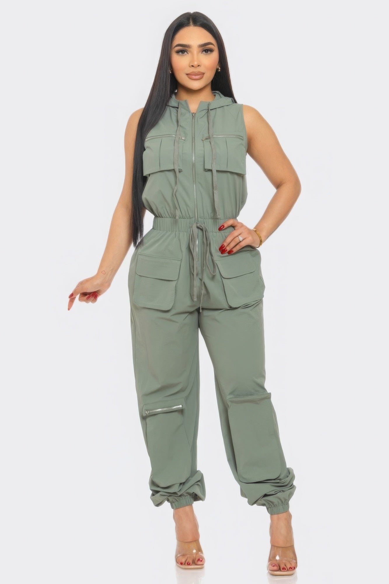 Women's utility jumpsuit for travel in olive green with multiple pockets and adjustable waist