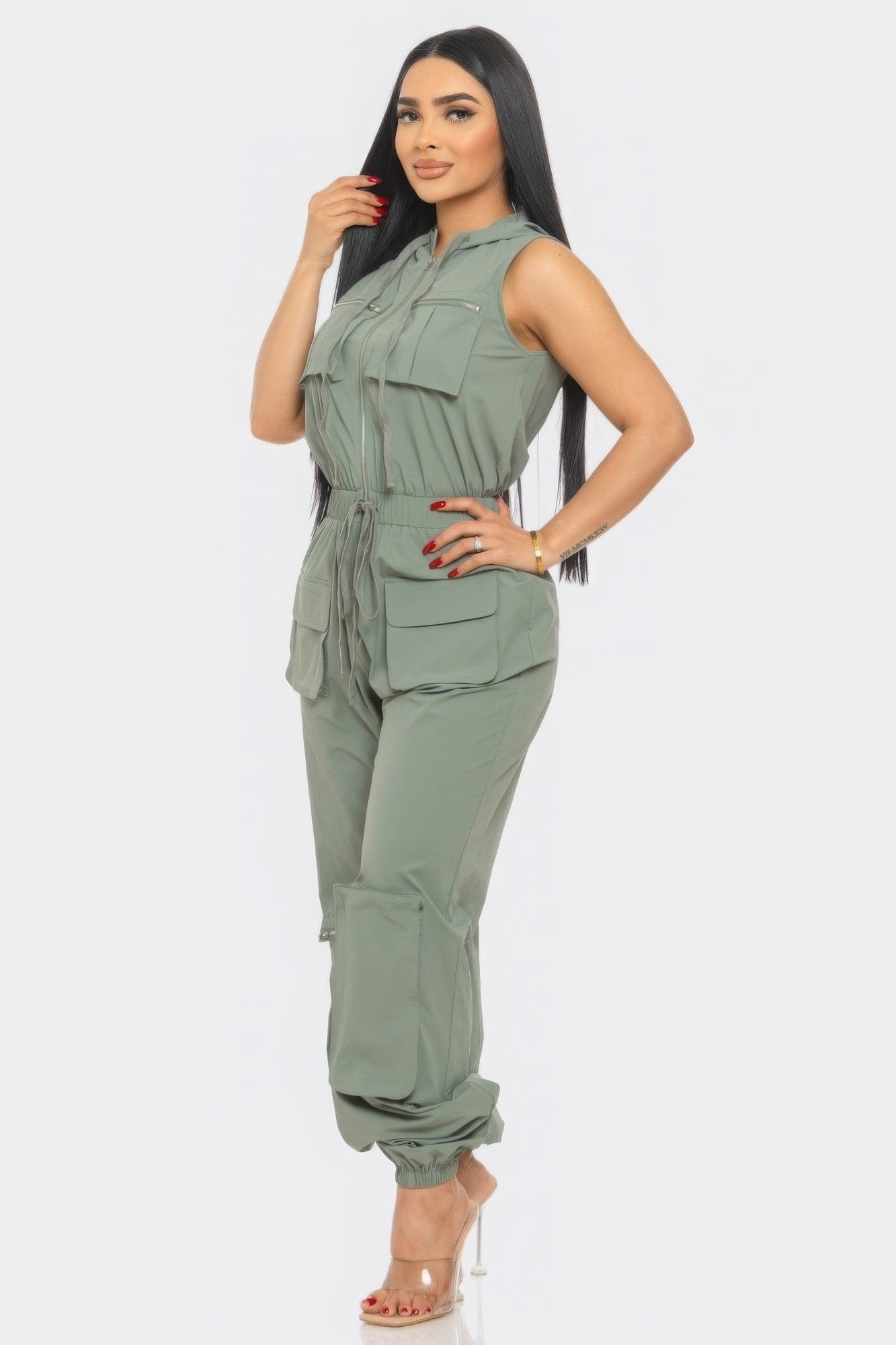 Stylish utility jumpsuit for travel in olive green with multiple pockets and adjustable waist