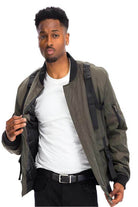 WEIV utility strap jacket for men in olive green with adjustable straps and zip pockets