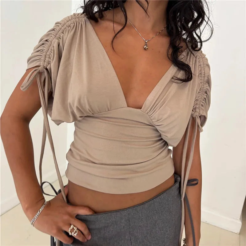 Women's beige v neck top with ruched sleeves, perfect for casual outings