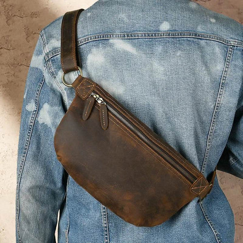 Vacation anti-theft bag in brown leather design, featuring a sleek zipper and adjustable strap for secure travel