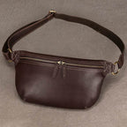 Vacation anti-theft bag in brown leather with adjustable strap and multiple zippered pockets for security