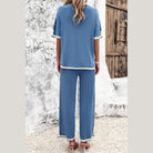 Back view of blue vacation casual knitwear for women two-piece outfit with white trim