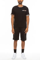 WEIV men's black vacation casual shorts for men paired with a matching black t-shirt and white sneakers