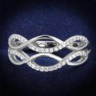 Elegant silver ring with intertwined design and sparkling stones, perfect vacation jewelry for women