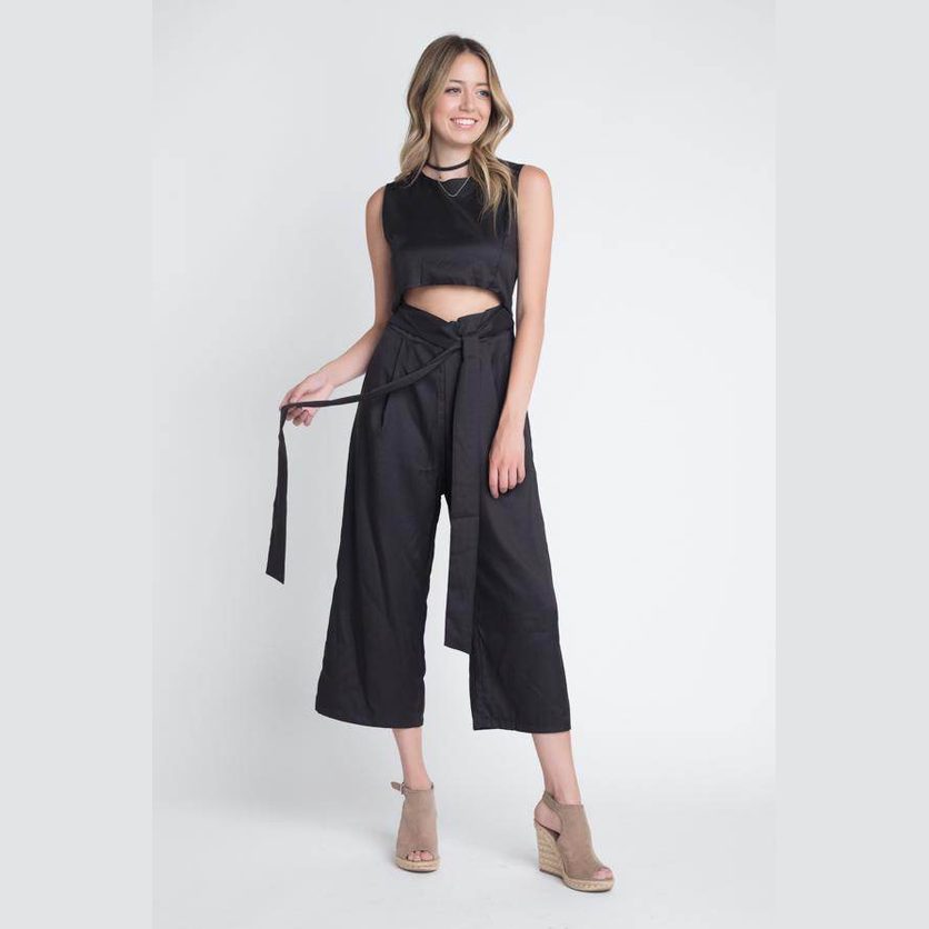 Women's vacation jumpsuit with slit in black, featuring a cropped top and stylish belt detail