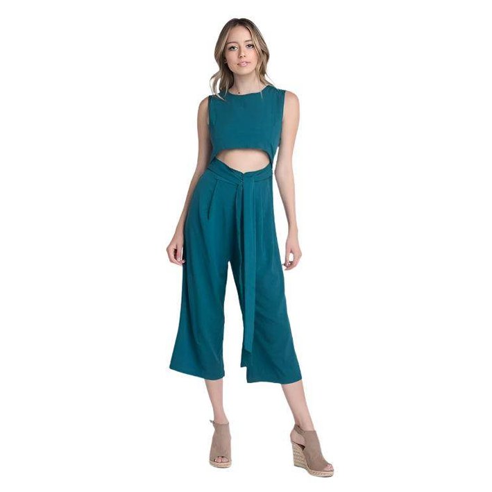 Ivory Felix vacation jumpsuit with slit in teal featuring a stylish cutout design and flowy pants