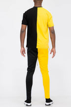 Back view of a men's activewear vacation mens clothing set in black and yellow colorblock design