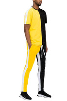 Vacation mens clothing set featuring a color-blocked tee and tapered pants in vibrant yellow and black