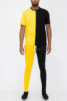 Vacation mens clothing set featuring a black and yellow split design activewear top and matching pants