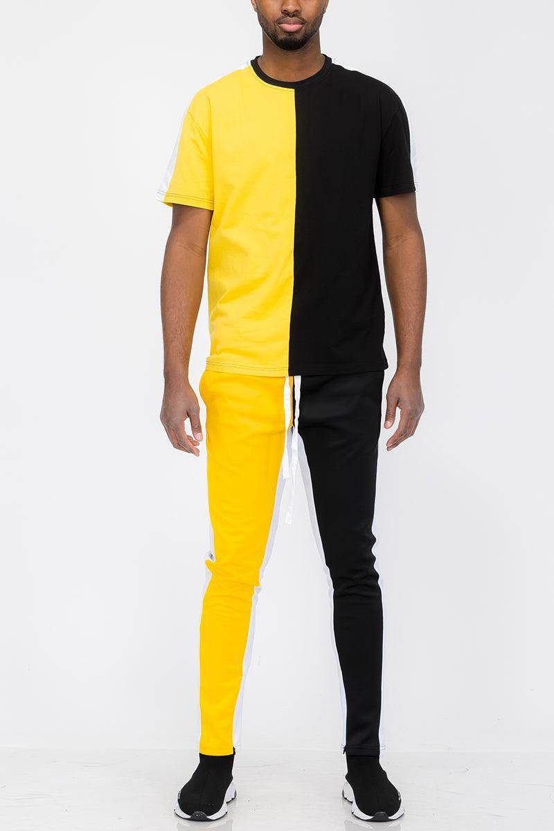 Vacation mens clothing set featuring a black and yellow split design activewear top and matching pants