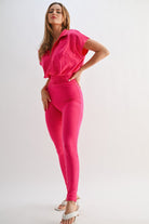 Stylish pink vacation outfit jumpsuit for women, perfect for summer vacations and casual outings