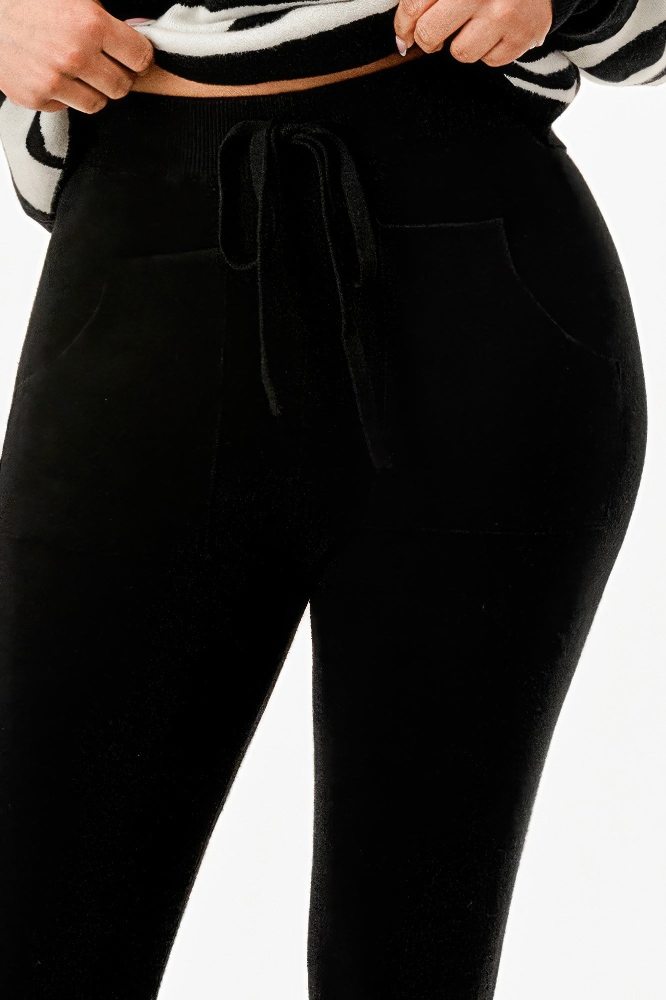 Cozy black joggers with adjustable tie and side pockets, perfect for vacation outfits for women