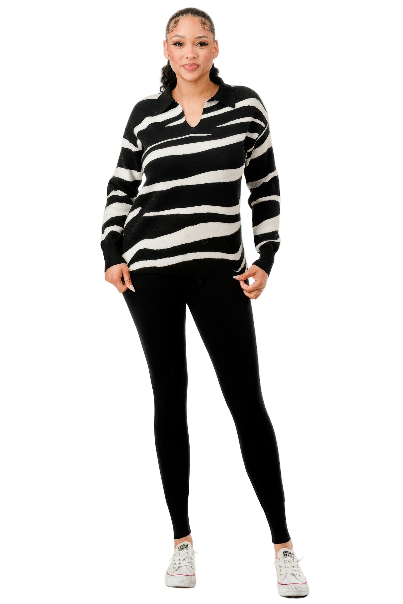 Casual black and white striped sweater with black leggings, perfect vacation outfits for women