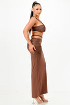 Brown two-piece set from VacationGrabs, perfect vacation outfits for women featuring a cropped top and high-slit skirt