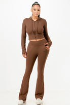 Chic brown women's outfit set with a crop hoodie and flared pants, perfect for vacation outfits for women