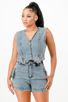 Stylish denim women's outfit featuring a button-up vest and high-waisted shorts, perfect vacation outfits for women