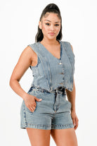 Stylish denim vacation outfits for women featuring a sleeveless cropped top and high-waist shorts