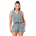 Stylish women's denim outfit featuring a cropped vest and matching shorts, perfect for vacation outfits for women.