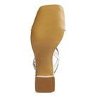 Sleek white vacation ready sandals white with a stylish heel for comfortable summer outings