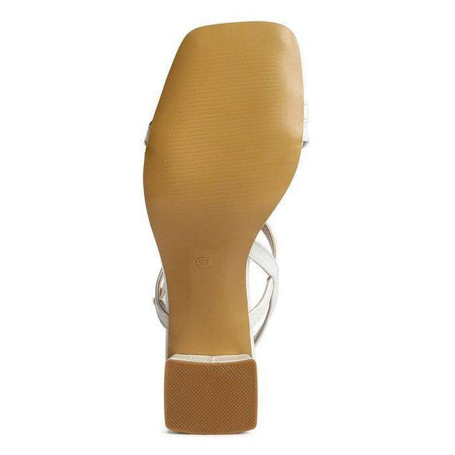 Sleek white vacation ready sandals white with a stylish heel for comfortable summer outings