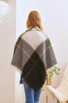 Bella Chic women's poncho in plaid pattern, ideal as a vacation style accessory for chilly evenings