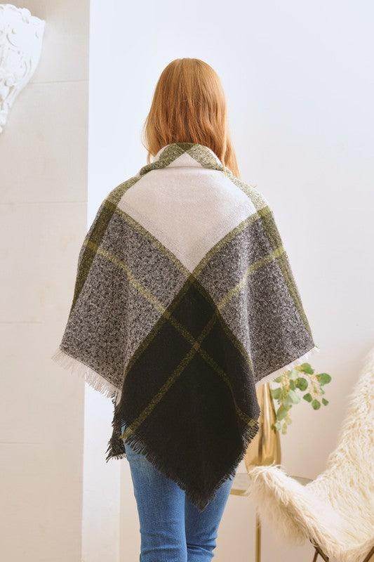 Bella Chic women's poncho in plaid pattern, ideal as a vacation style accessory for chilly evenings