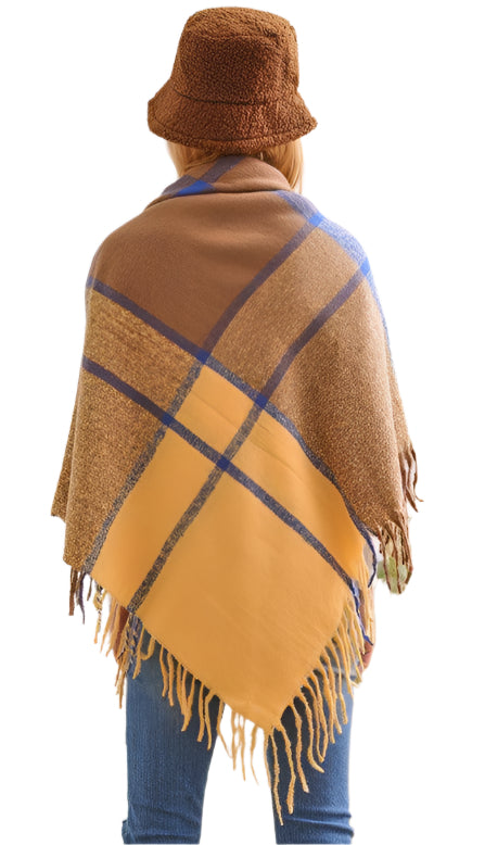 Stylish Bella Chic plaid shawl with fringe, perfect as a vacation style accessory