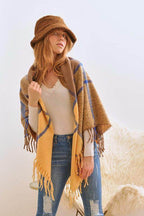 Stylish Bella Chic vacation style accessory featuring a cozy shawl and a chic hat