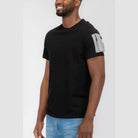 Men's vacation style black tee with a stylish pocket detail for a casual look