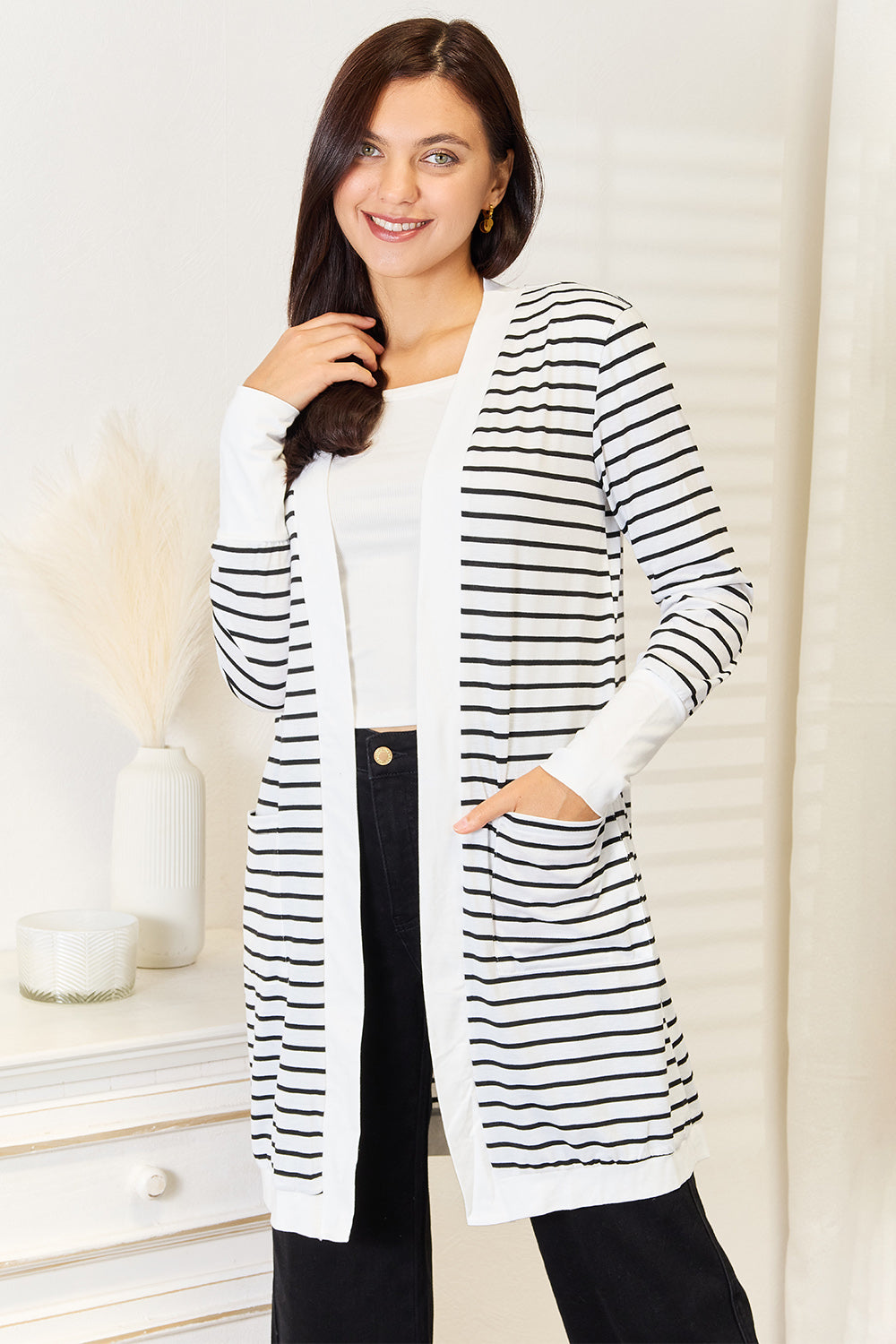 Trendsi women's vacation style cardigan in black and white stripes with pockets for a chic look