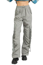 Emory Park women's vacation style cargo pants in light gray with utility pockets and adjustable straps