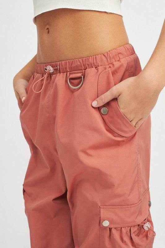 Emory Park women's vacation style cargo pants in pink with side pockets and stretchy waistband