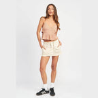 Emory Park women's vacation style crop top in peach with adjustable straps and pleated design