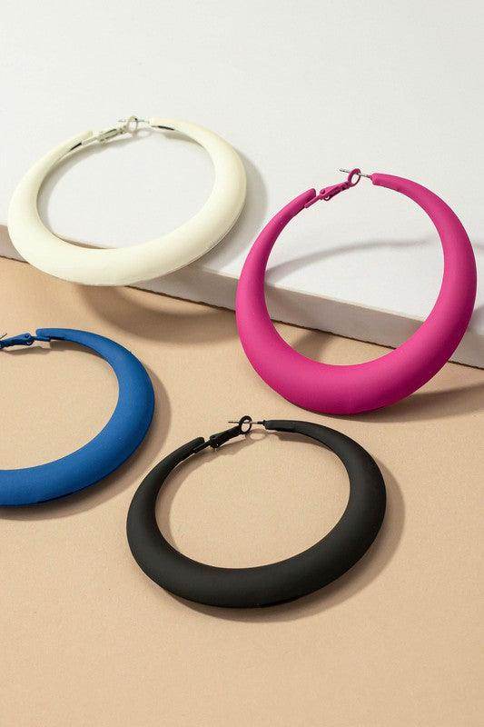 Colorful LA3accessories vacation style earrings in various shades including black, pink, white, and blue