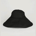 Bella Chic black vacation style hat with a wide brim for sun protection and stylish outdoor wear