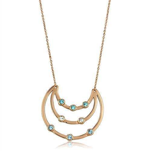 Vacation style jewelry necklace with a gold-tone design and sparkling blue stones