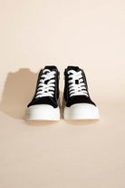 Fortune Dynamic women's vacation style lace up shoes in black with white laces and sole