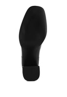 Bottom view of Rag Company vacation style leather boots with a sleek black design and sturdy sole