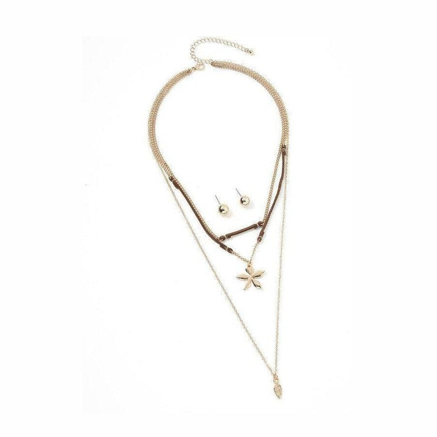 Bella Chic vacation style necklace with layered chains and a star pendant for a trendy look